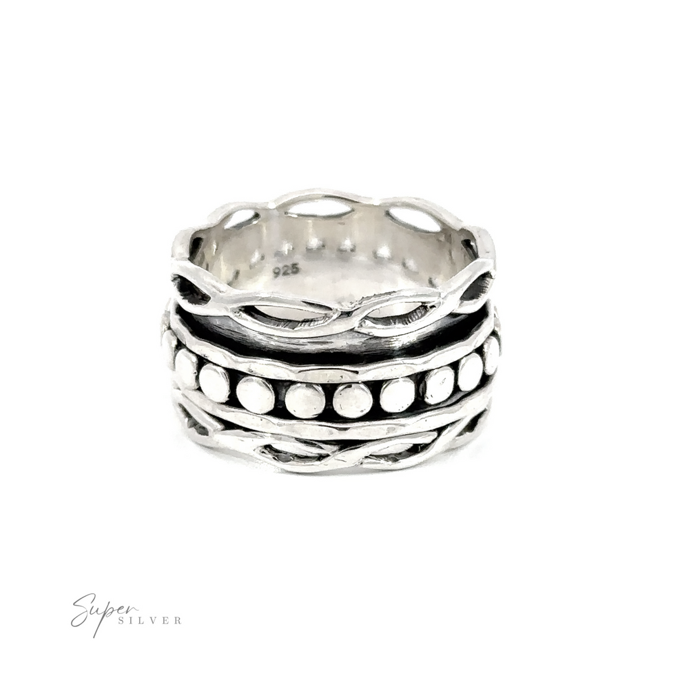 A Spinner Ring with Twisted Borders with black and white beads in a circle band.
