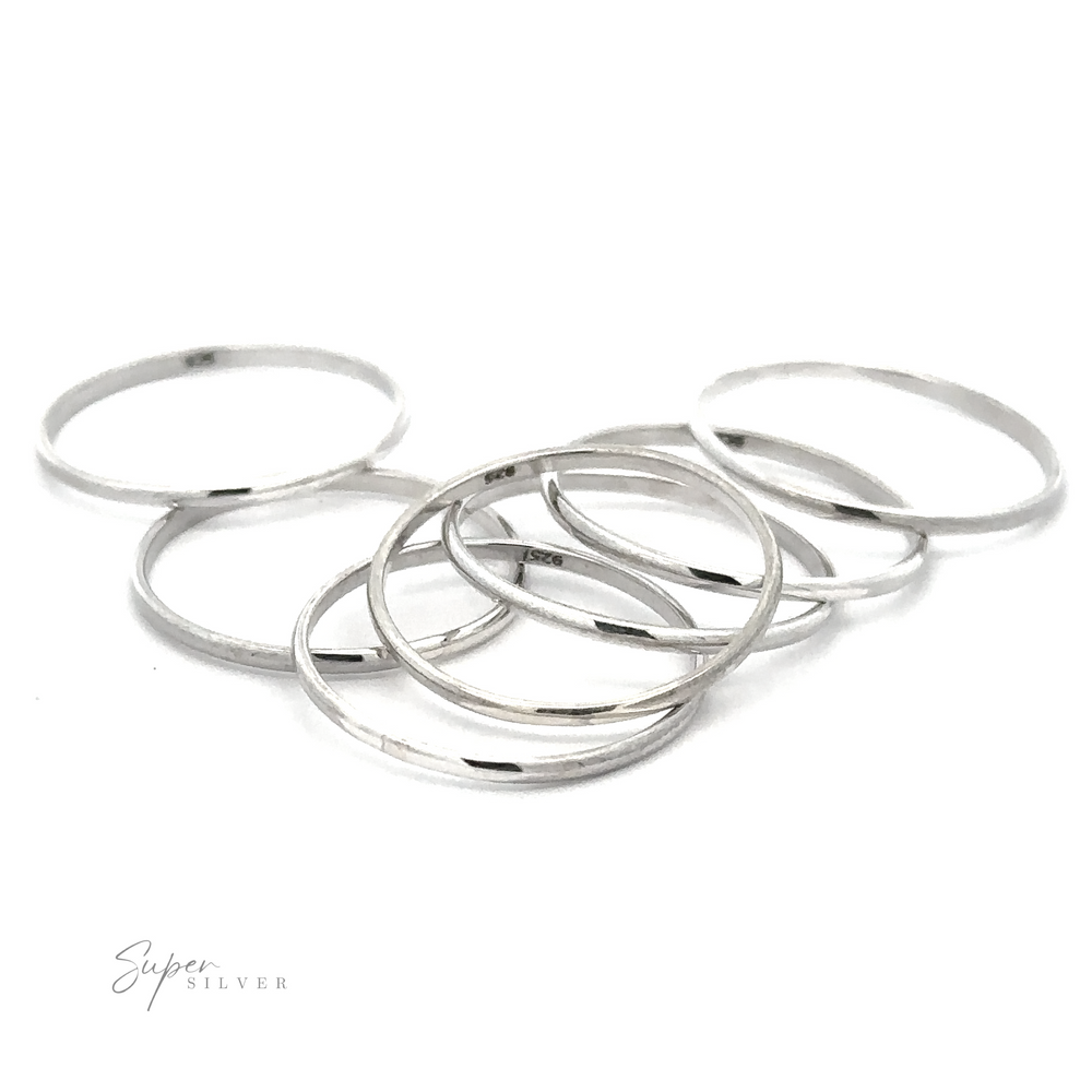 A delicate stack of 1.2mm Plain Bands on a white background.