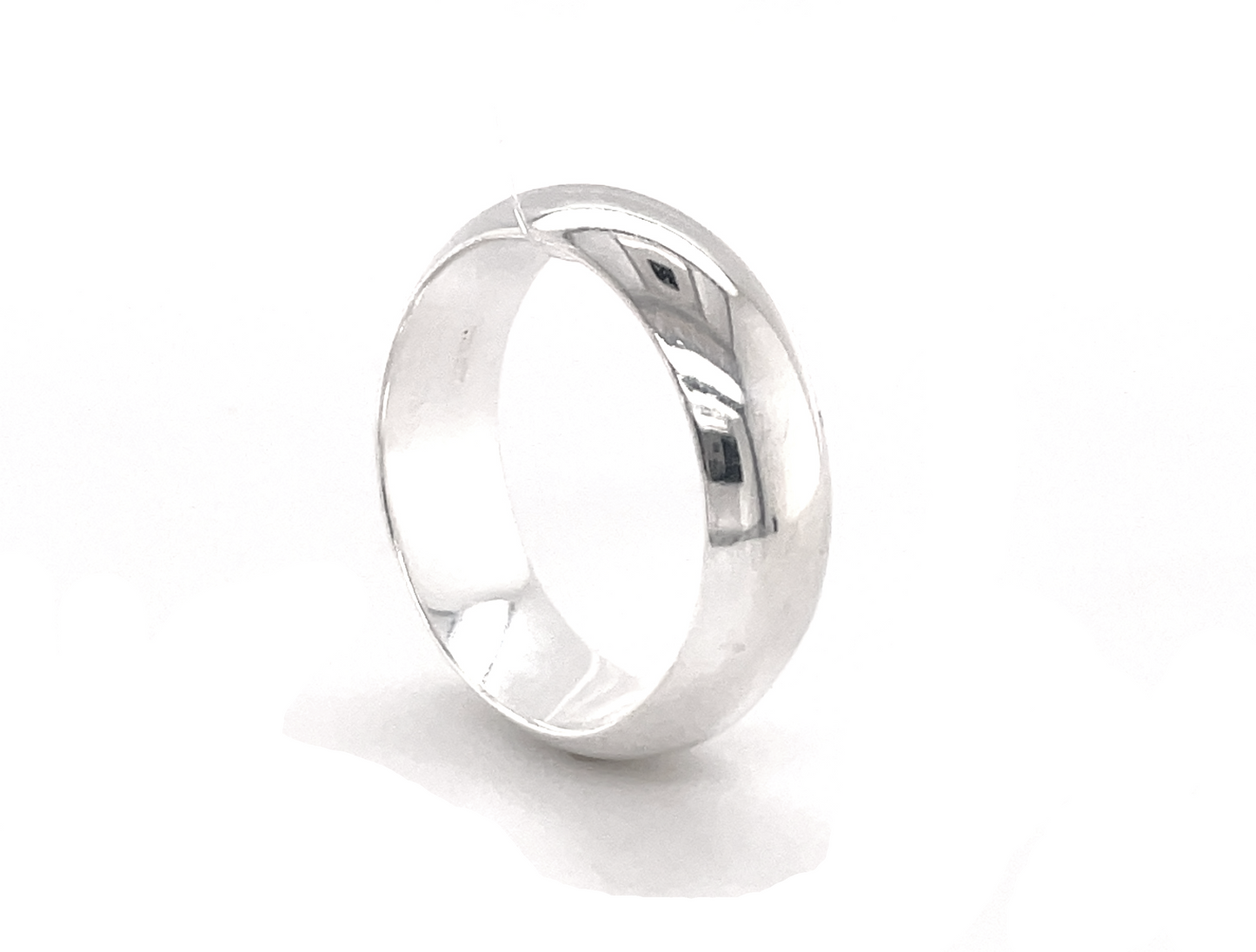 
                  
                    A 7mm Plain Band wedding ring with rounded band dimensions on a white background.
                  
                