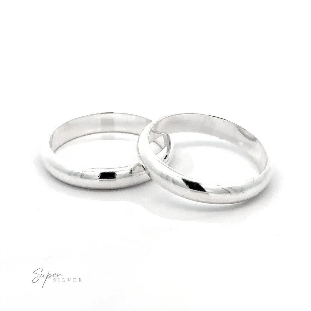 Two simple 4mm Plain Band wedding rings on a white background.