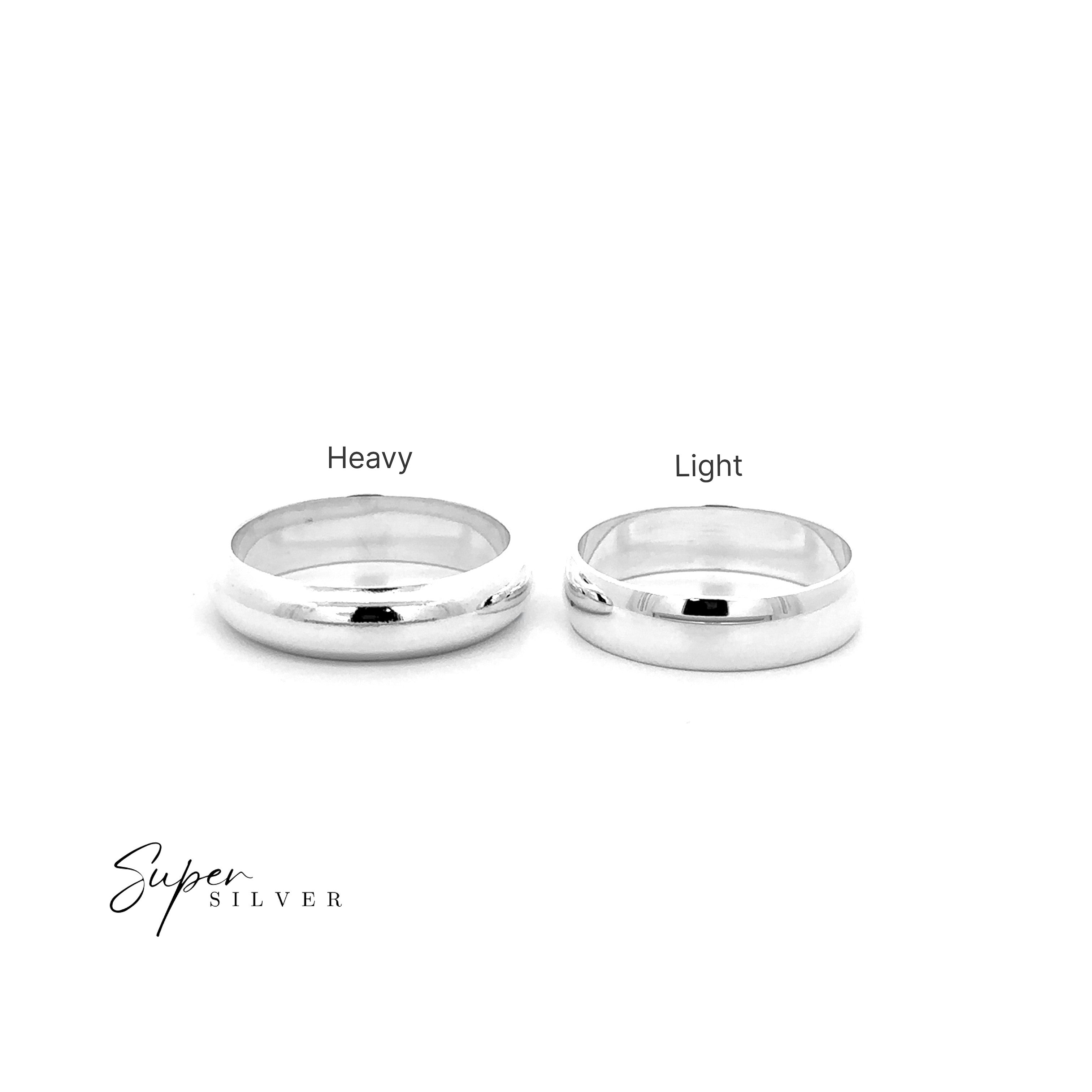Two 5mm Plain Bands side by side on a white background: a "Heavy" ring on the left and "Light" on the right, both labeled with "Super Silver" in the corner, show classic half-round and comfort band styles.