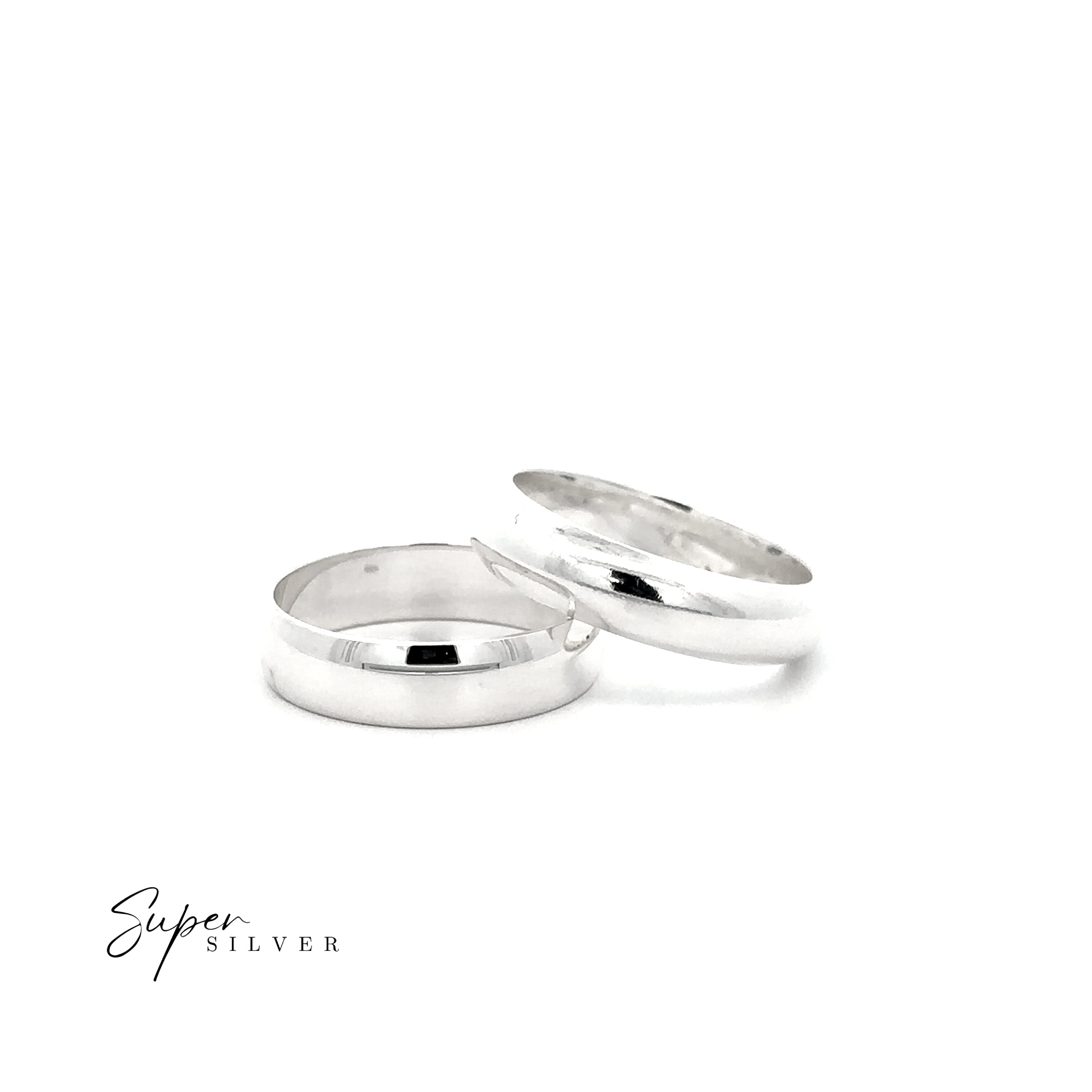 A 5mm Plain Band in sterling silver is displayed on a white background: one half-round ring stands upright, leaning against a comfort band that lies flat. "Super Silver" is written in the corner.