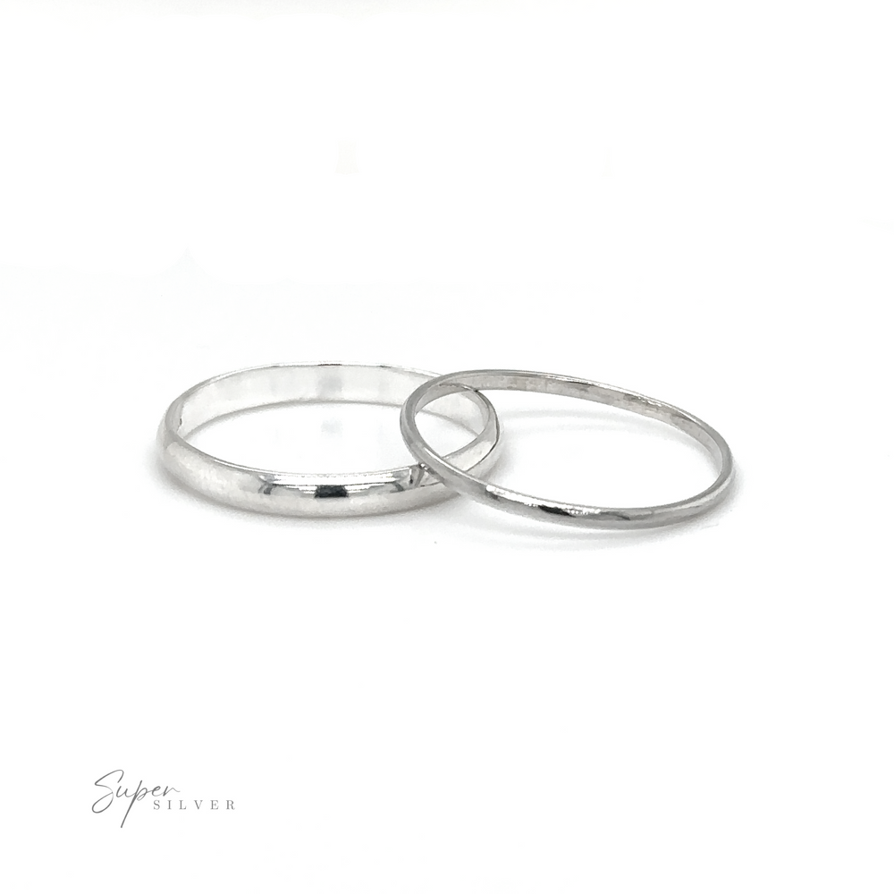 
                  
                    Two Light Weight Simple Bands silver wedding rings on a white background, perfect for stacking.
                  
                