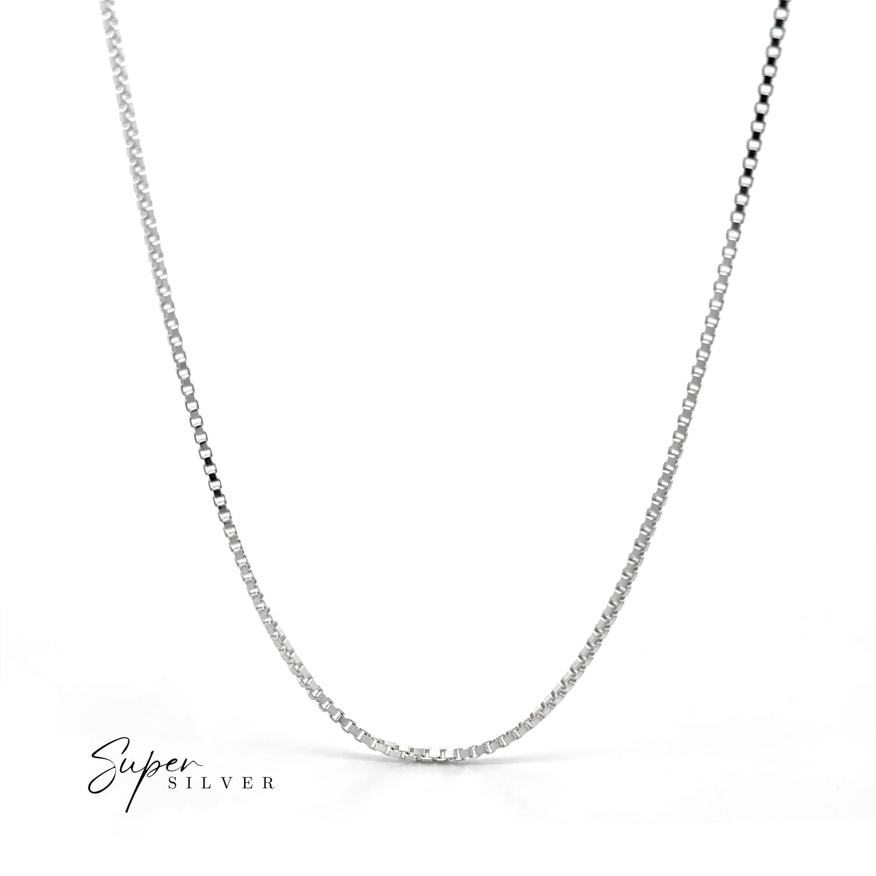 The Italian Edge Box Chain, a minimalist sterling silver necklace, is displayed on a white background with "Super Silver" text in the lower left corner. Ideal for men seeking a sleek, modern style.