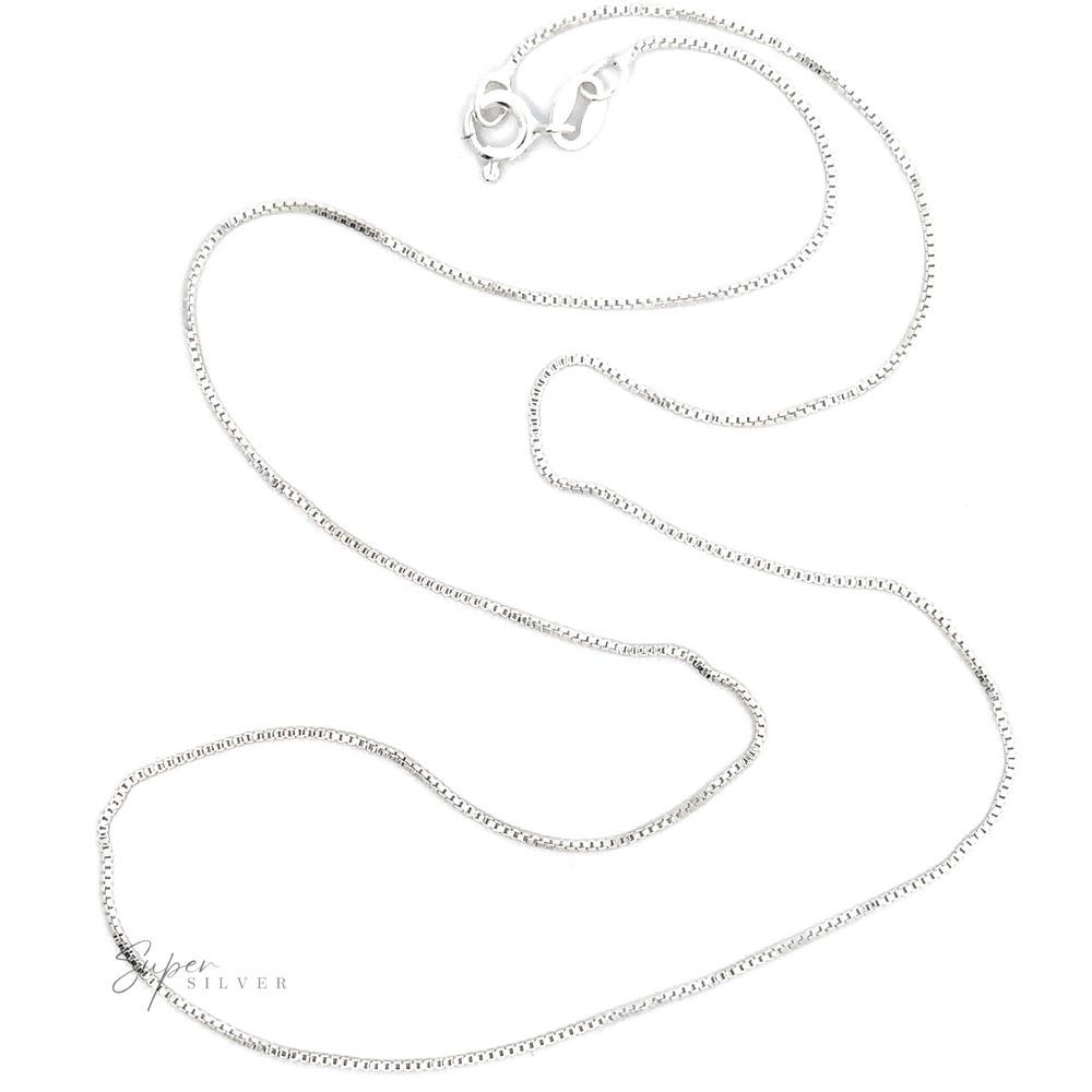 A Delicate Sterling Silver Box Chain Necklace with a lobster clasp, laid out smoothly on a white background.