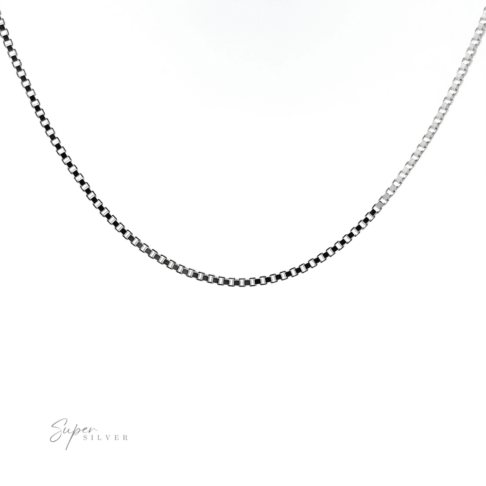 
                  
                    Close-up of an Adjustable Silver Box Chain necklace made of Sterling silver, showcased against a white background with "Super Silver" text in the lower left corner. Ideal for layering necklaces.
                  
                