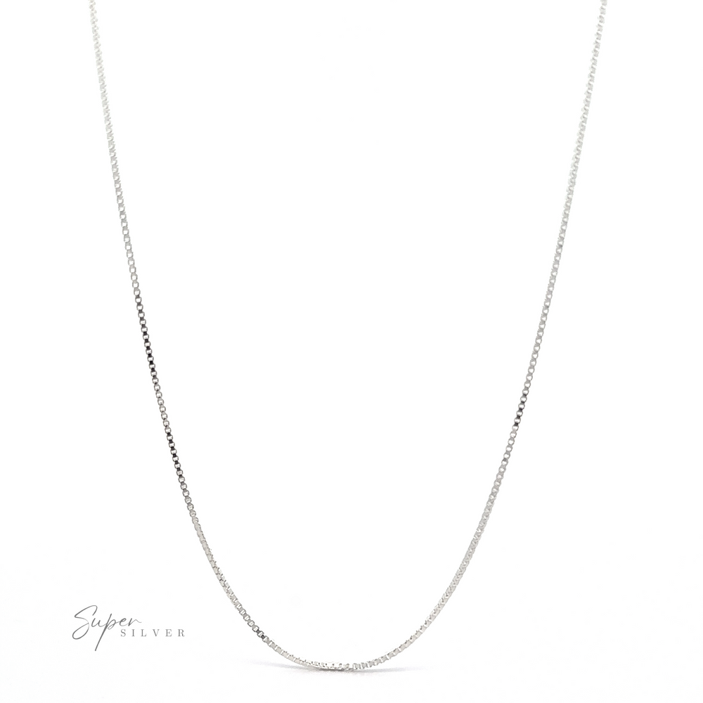 An elegant Adjustable Silver Box Chain necklace with a minimalist design is showcased against a white background. The text 