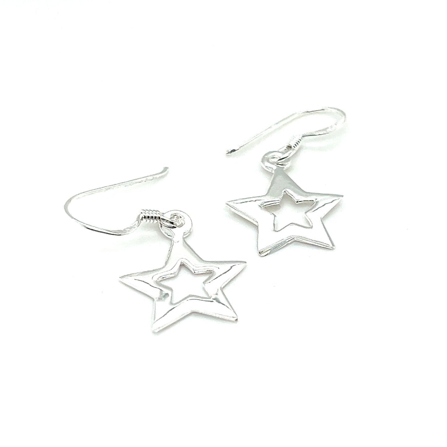 A pair of Super Silver Open Star Earrings shining against a white background, emitting celestial splendor.