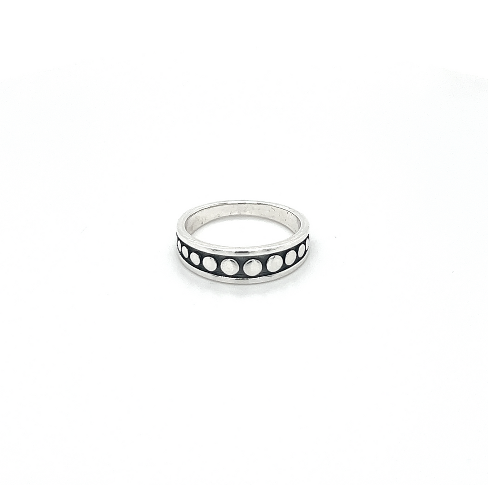 A sterling silver Moon Phase Band Ring with an oxidized finish.