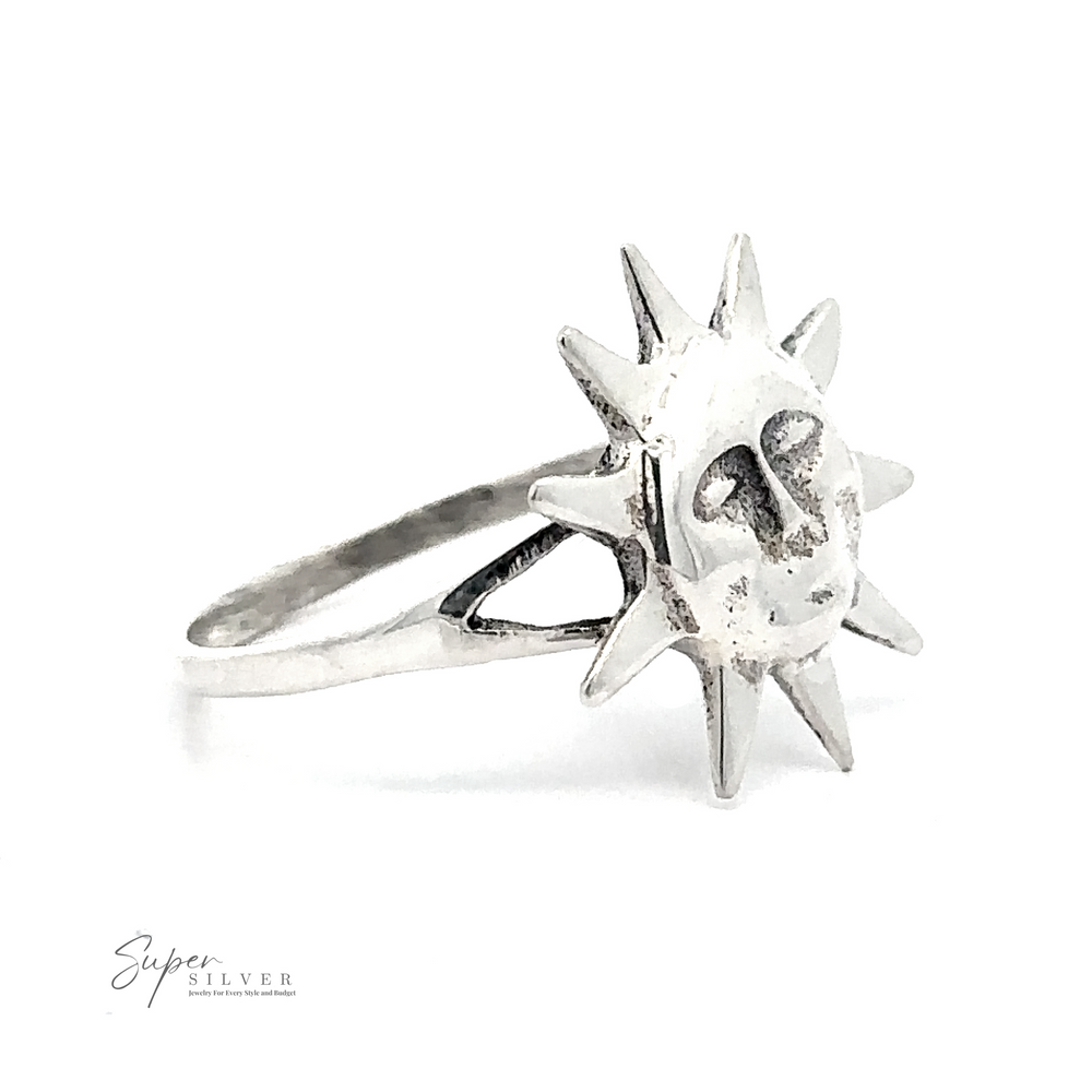 
                  
                    The Silver Sun Ring is a sterling silver ring adorned with a sun design that has a face on the front. The words "Super Silver" are printed in small font at the bottom left of the image.
                  
                