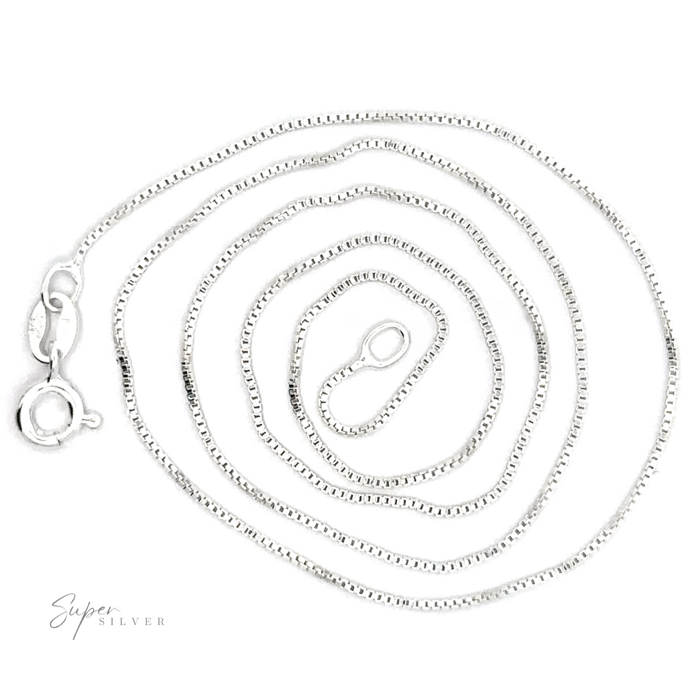 
                  
                    A coiled Delicate Sterling Silver Box Chain necklace with a lobster clasp, featuring timeless appeal and Italian-made craftsmanship.
                  
                