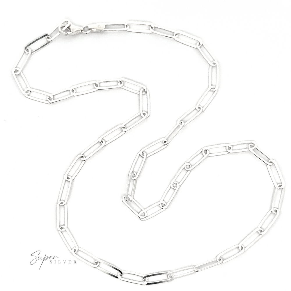 
                  
                    The Sterling Silver Paperclip Chain is displayed on a white background, featuring rectangular links arranged in an S-shape and the text "Super Silver" in the lower-left corner. This necklace exemplifies Italian craftsmanship and minimalistic design.
                  
                