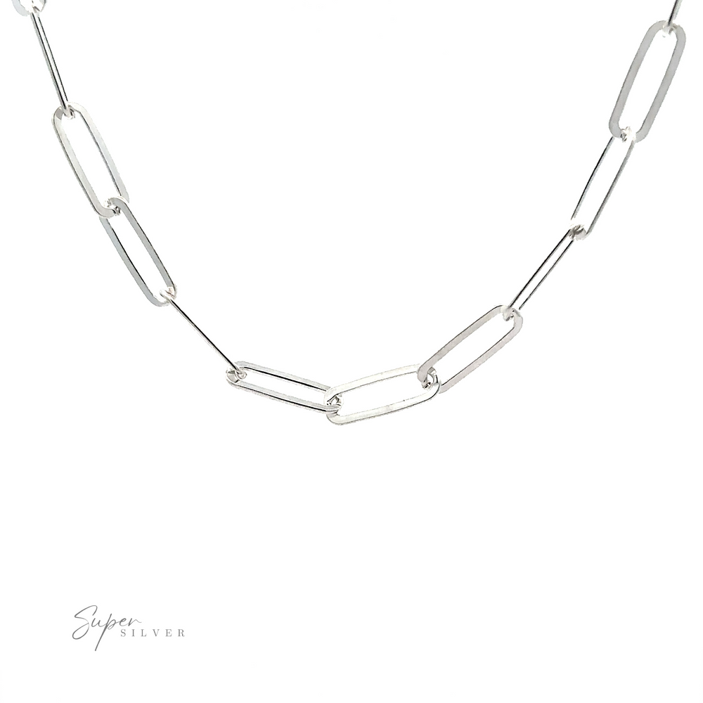 
                  
                    A Sterling Silver Paperclip Chain is displayed against a white background, showcasing its minimalistic design with elongated oval links. The brand name "Super Silver" appears in the bottom left corner, highlighting Italian craftsmanship.
                  
                