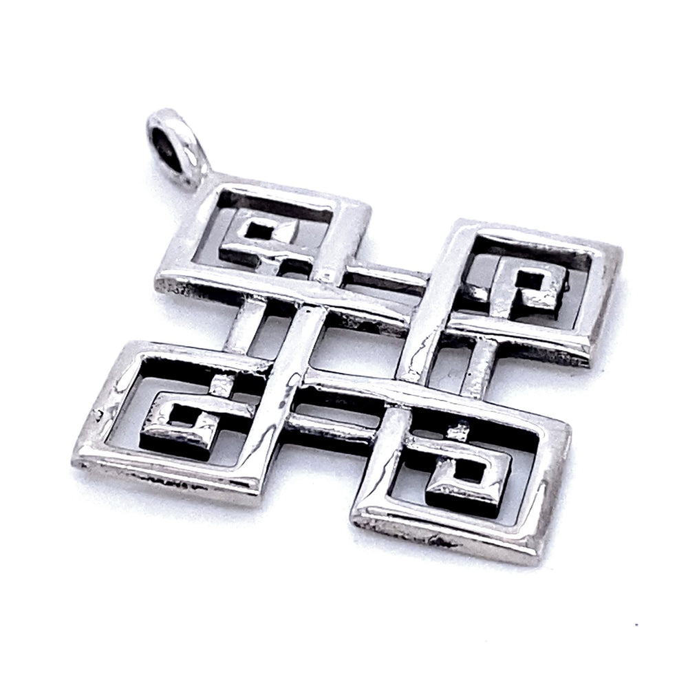 Four-Pointed Celtic Knot Pendant with an intricate geometric design featuring interlocking squares and spirals, reminiscent of a classic Celtic knot.