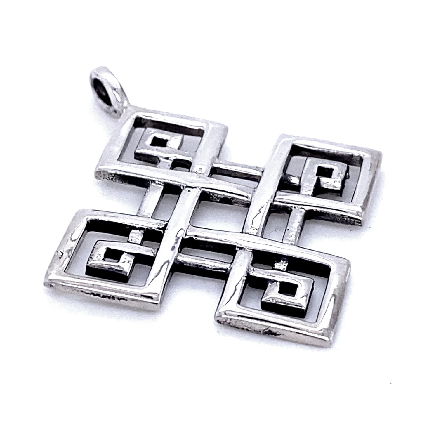 Four-Pointed Celtic Knot Pendant with an intricate geometric design featuring interlocking squares and spirals, reminiscent of a classic Celtic knot.