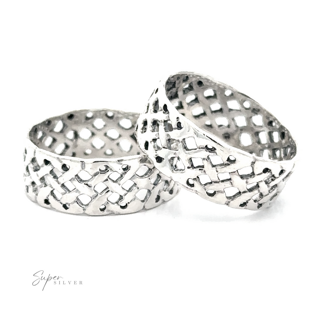 Two Celtic Band Rings on a white background, symbolizing commitment.