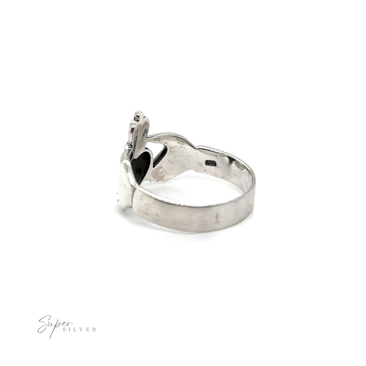
                  
                    A Thick Claddagh ring, symbolizing love and loyalty, featuring a silver band and a black stone at its center.
                  
                
