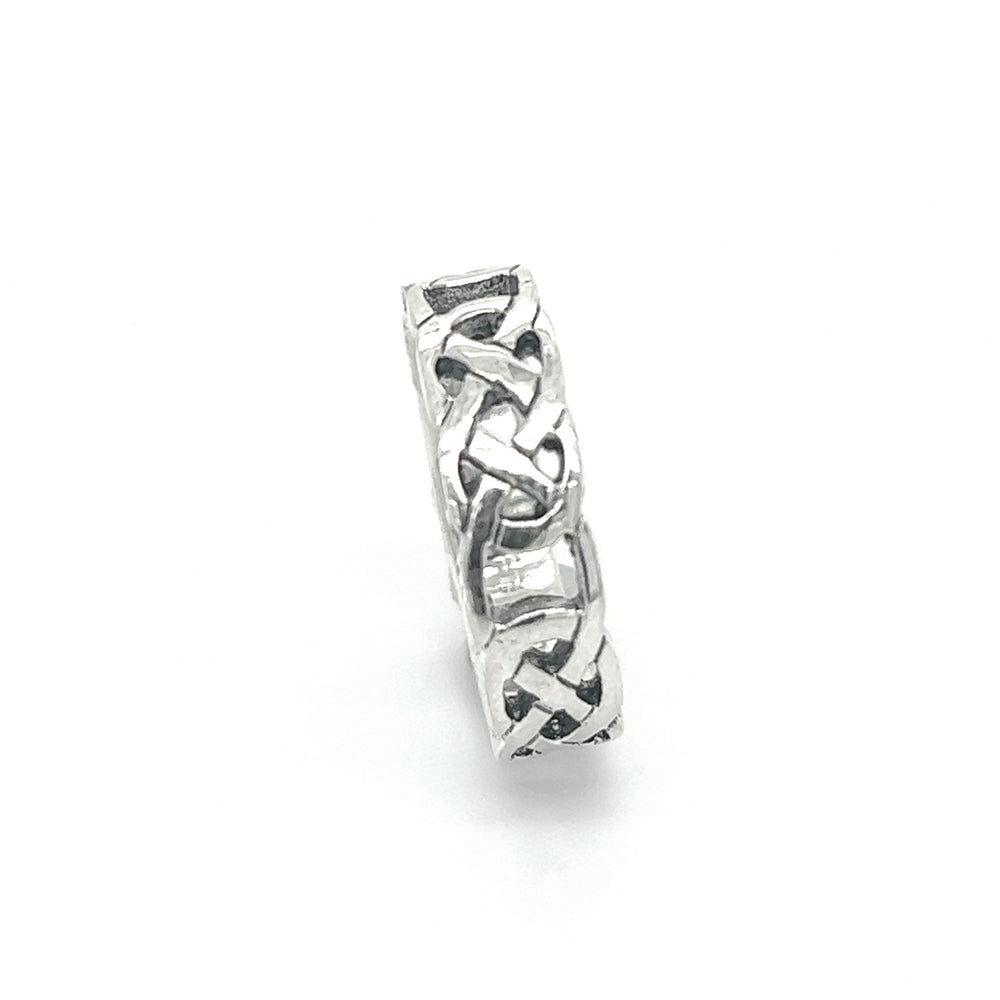 
                  
                    A stunning sterling silver 5mm Celtic Knot Band featuring a mesmerizing celtic knot design.
                  
                
