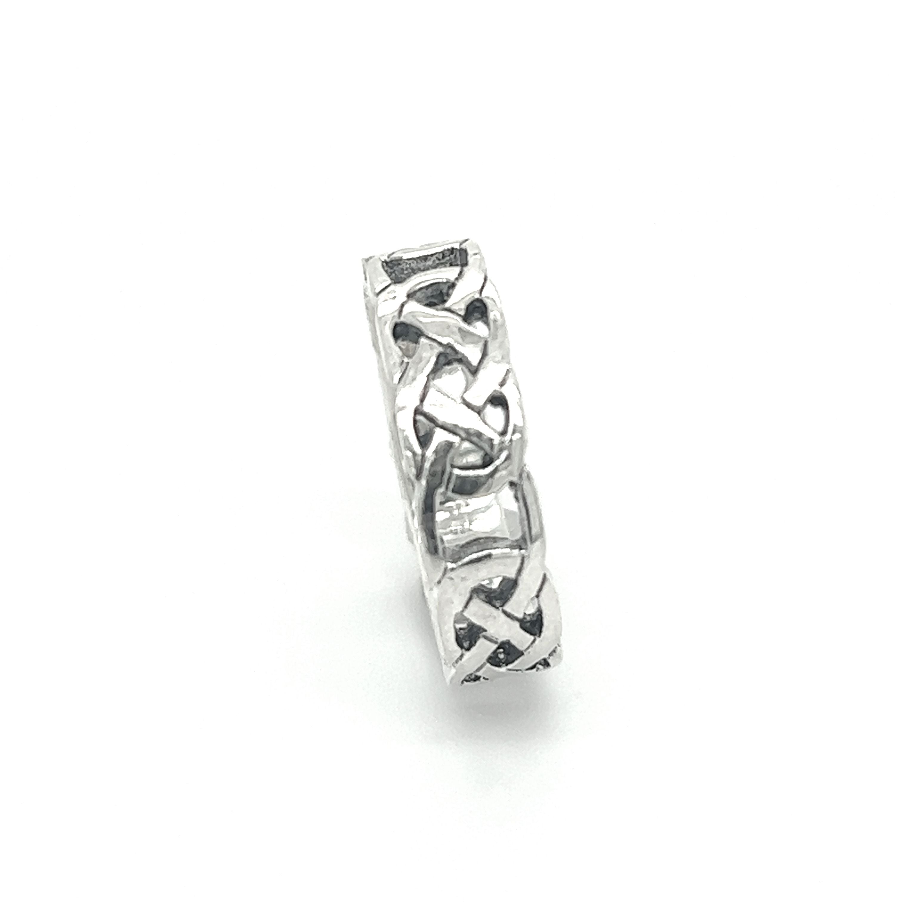 A stunning sterling silver 5mm Celtic Knot Band featuring a mesmerizing celtic knot design.