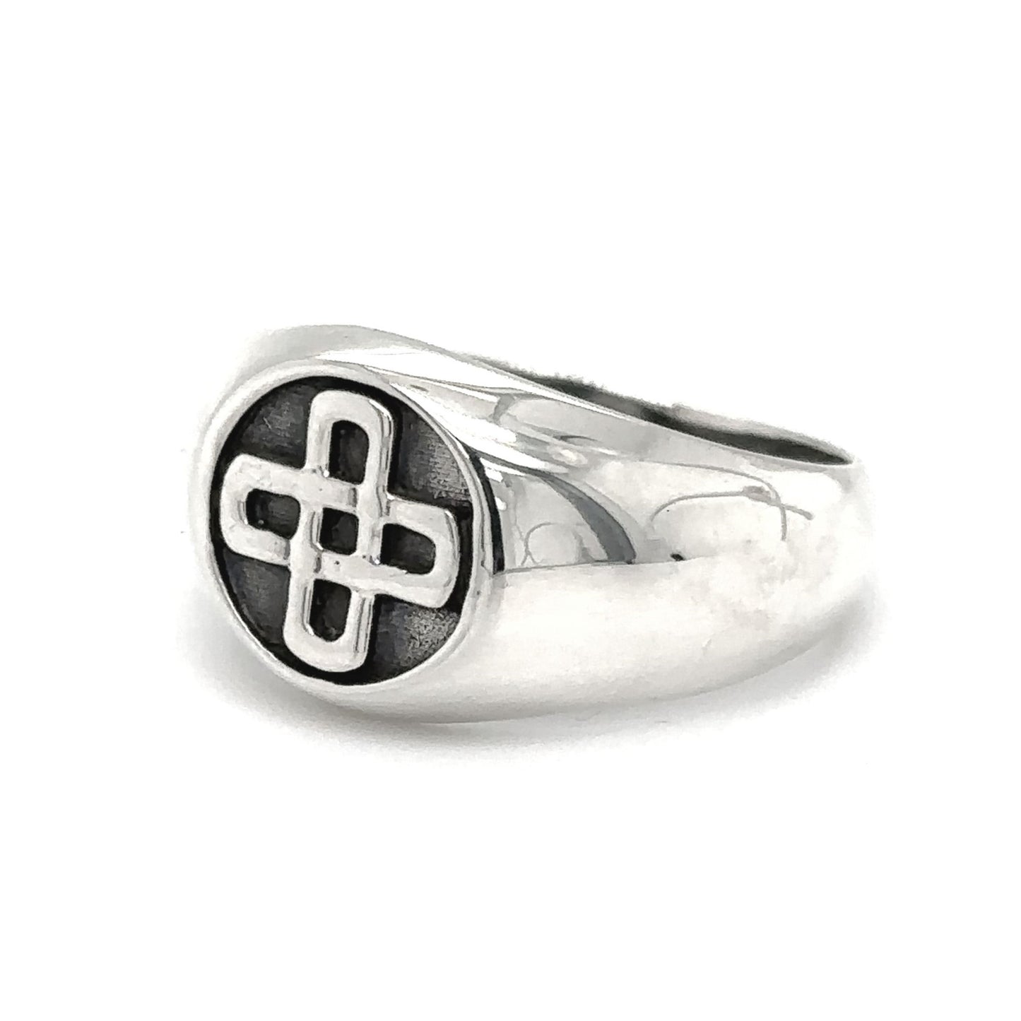 An oxidized silver Celtic Solomon's Knot signet ring with a cross on it, making it a stunning statement piece that incorporates the timeless design of Solomon's Knot.