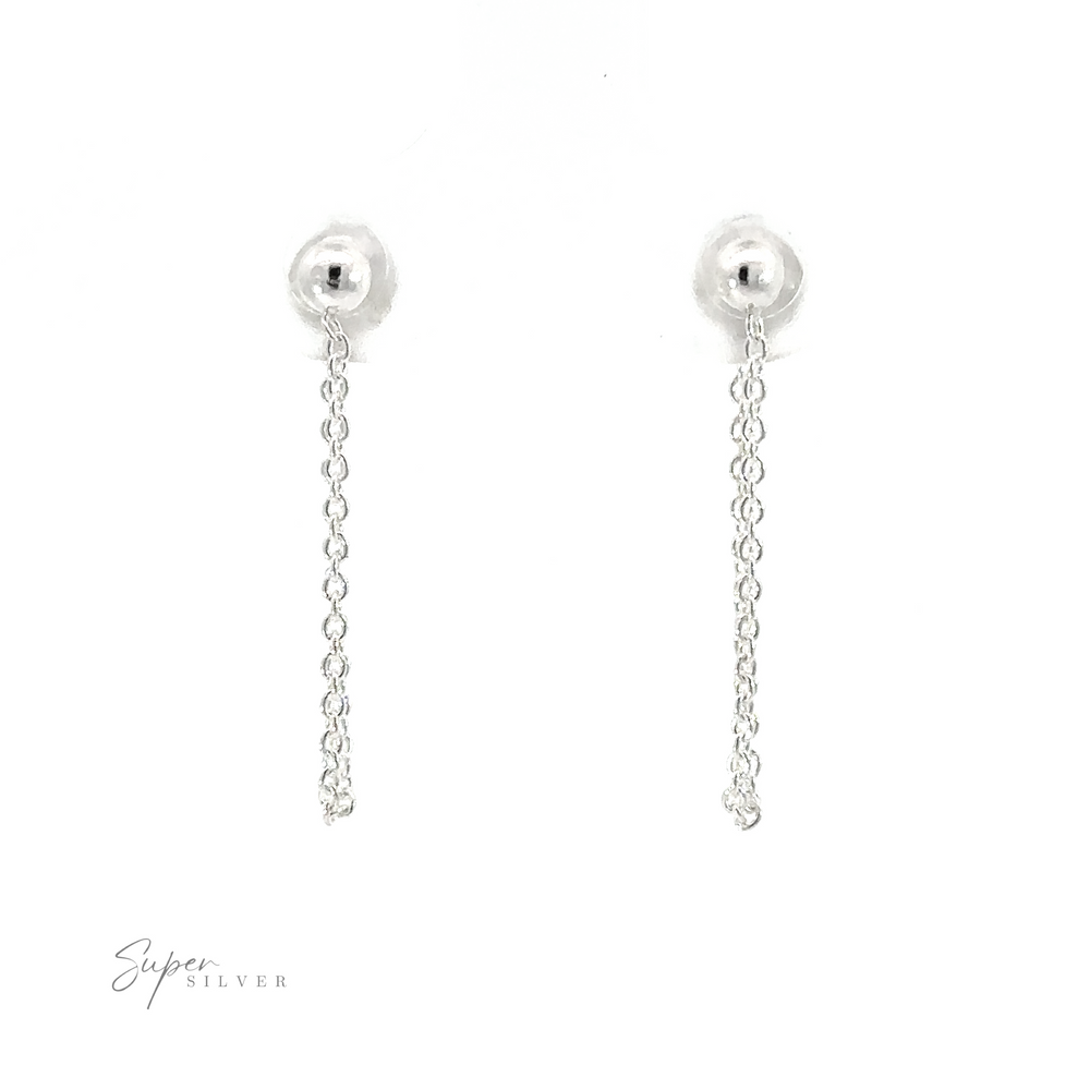 
                  
                    Crafted from .925 sterling silver, these Ball Stud with Dangling Chain earrings exude a minimalist style with their ball and chain design.
                  
                