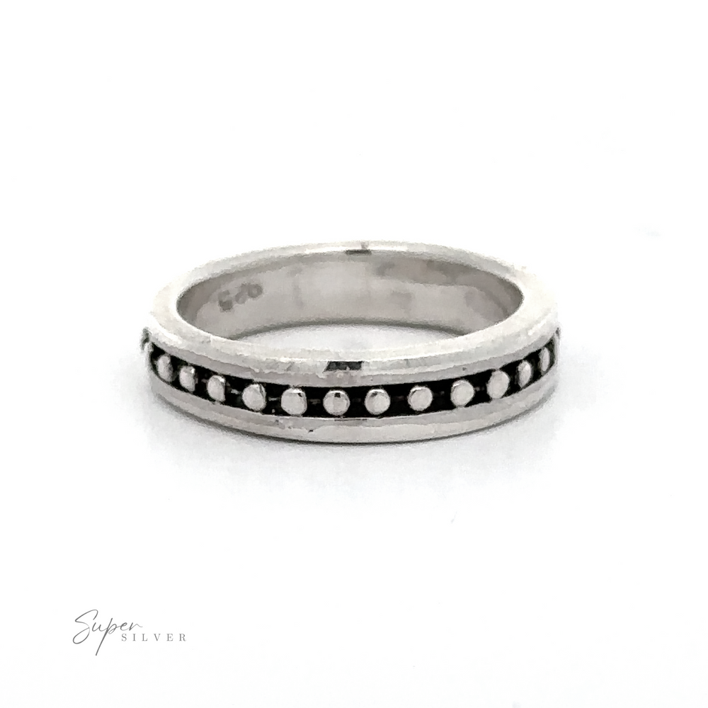 This Silver Band with Ball Pattern is sure to look elegant on any hand. The sleek band will compliment any outfit perfectly.