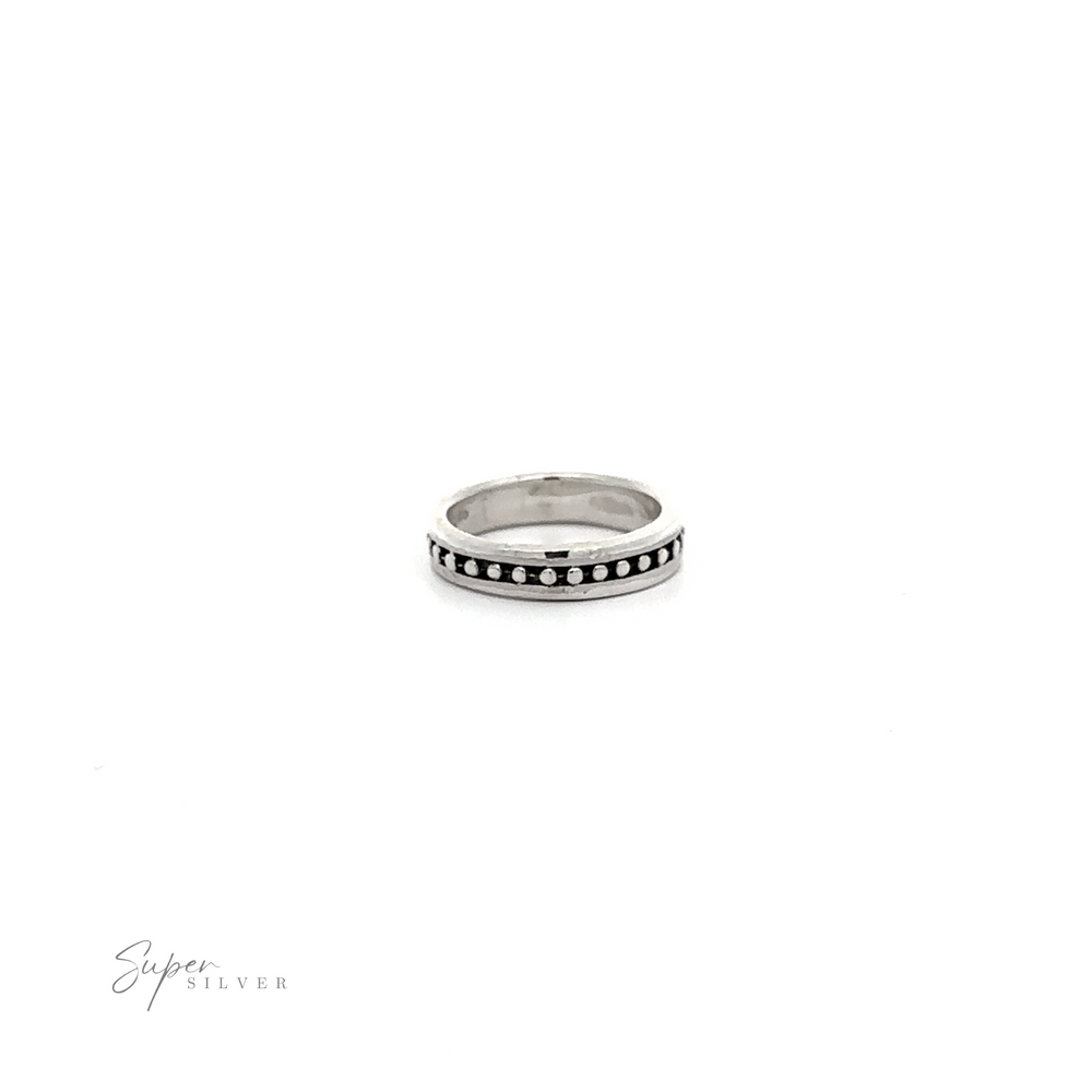 
                  
                    A Silver Band with Ball Pattern adorned with black dots on a white background, creating a stylish and elegant design that is sure to compliment any outfit.
                  
                