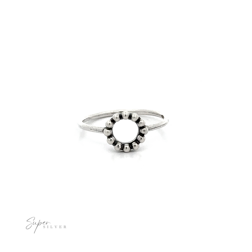 
                  
                    A Silver Ring With Circle And Beads with an oxidized finish and a beaded circle design in the middle.
                  
                