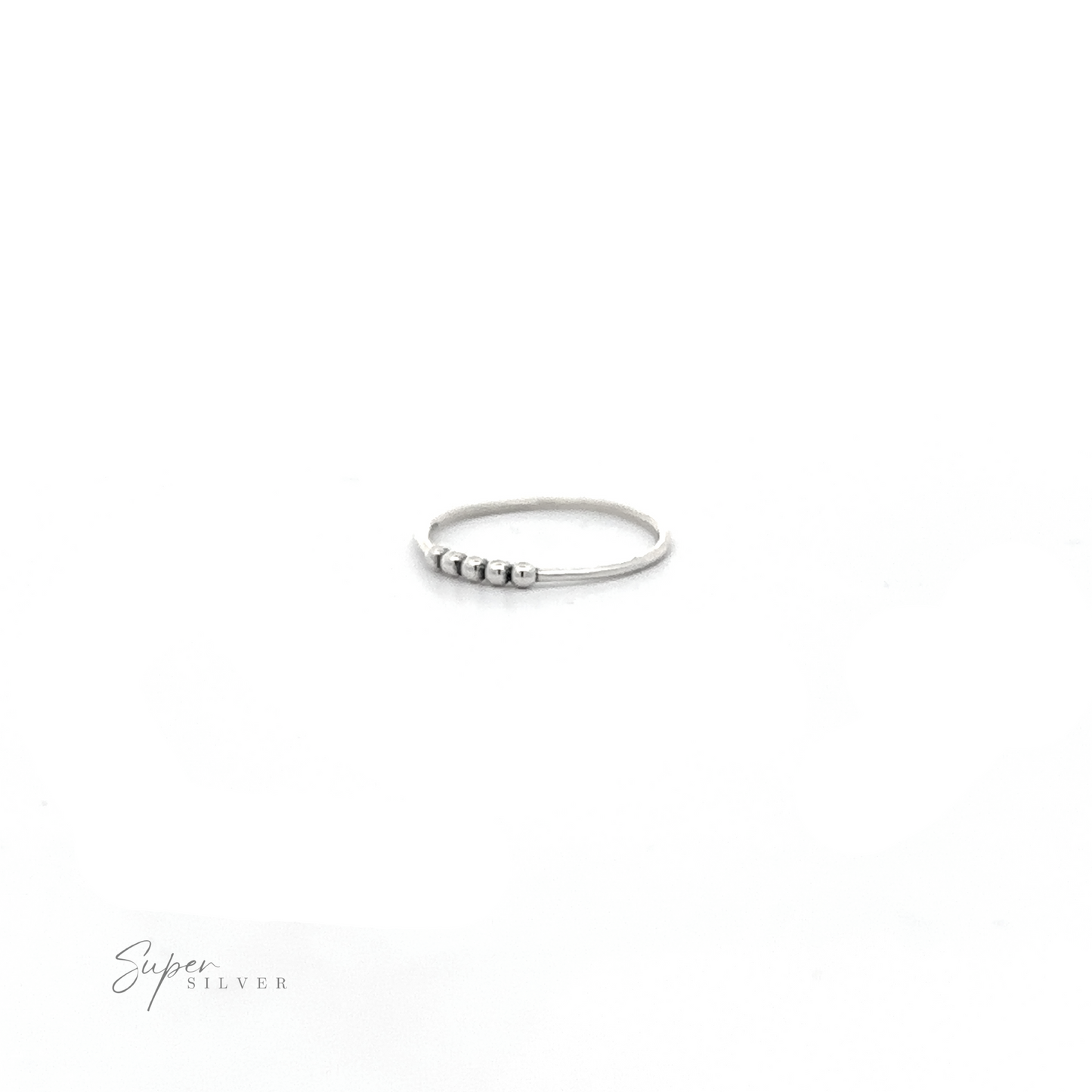 
                  
                    A silver ring with black stones and an oxidized finish called "Silver Ring With Beads" on a white background.
                  
                