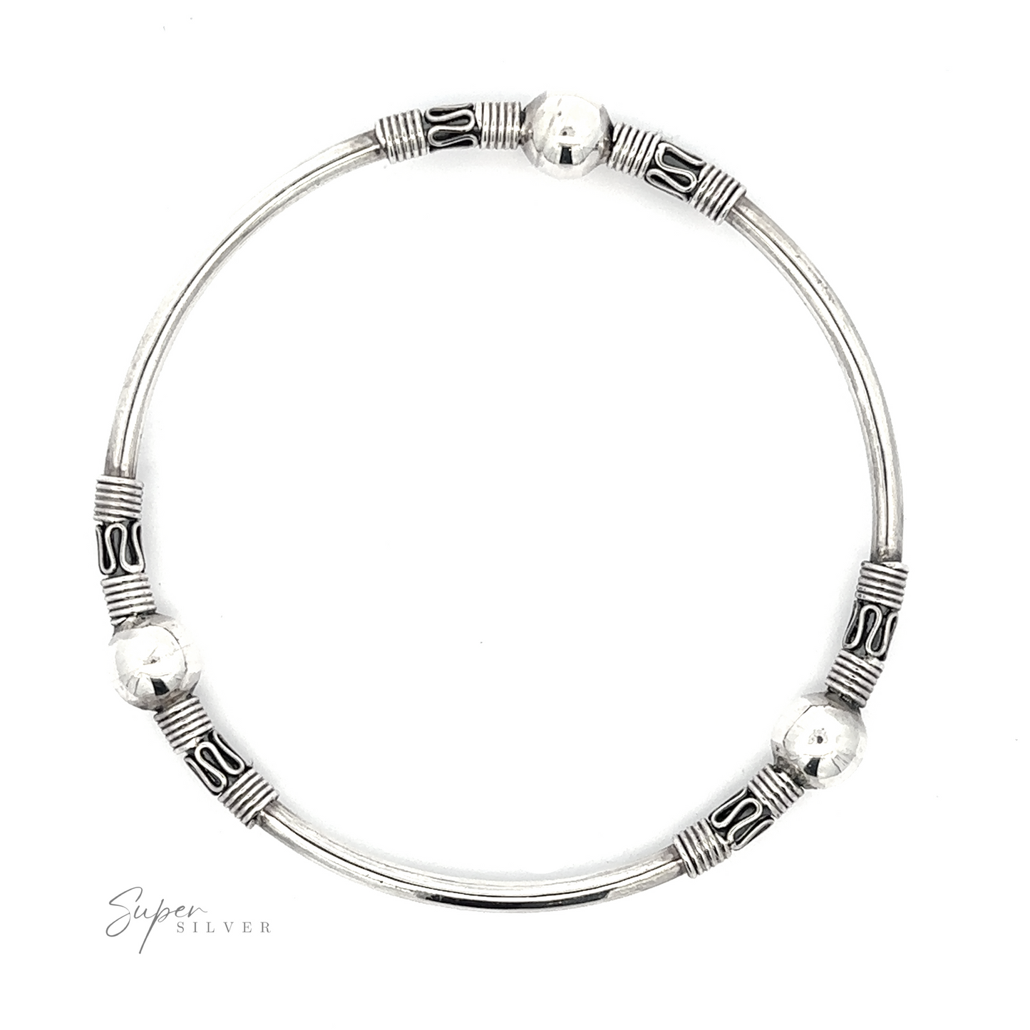 A Silver Bali Style Bangle Bracelet adorned with decorative beads and intricate patterns, capturing the essence of a Balinese style bangle.