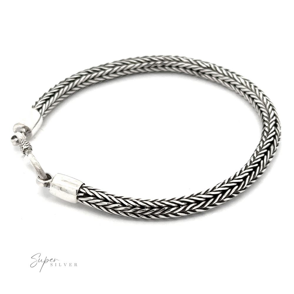 A 4mm Braided Bracelet with a simple clasp, featuring a braided rope design and the text “Super Silver” in the corner. Perfect for everyday stacking.