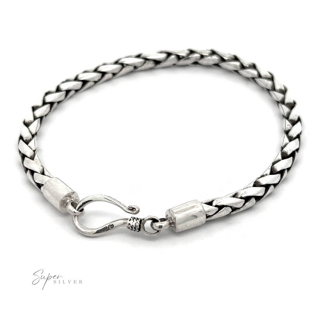 
                  
                    A 4mm Bright Rope Bracelet with a hook clasp is displayed on a white background. The bracelet appears intricately designed with a polished finish, perfect for stacking or wearing alone.
                  
                