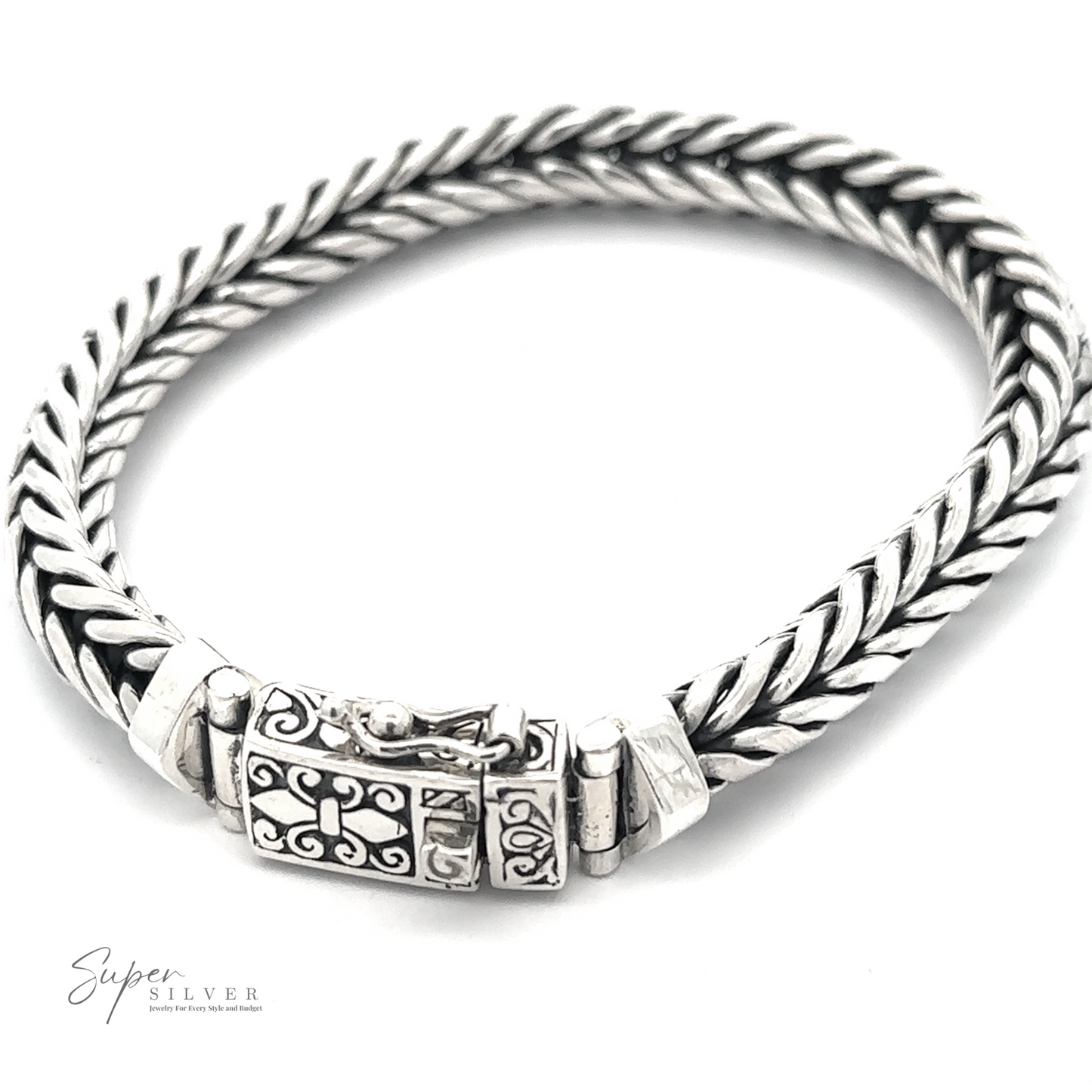 
                  
                    A Heavy Braided Bracelet with an ornate clasp, displayed on a white background. The logo "Super Silver" is visible in the bottom left corner.
                  
                