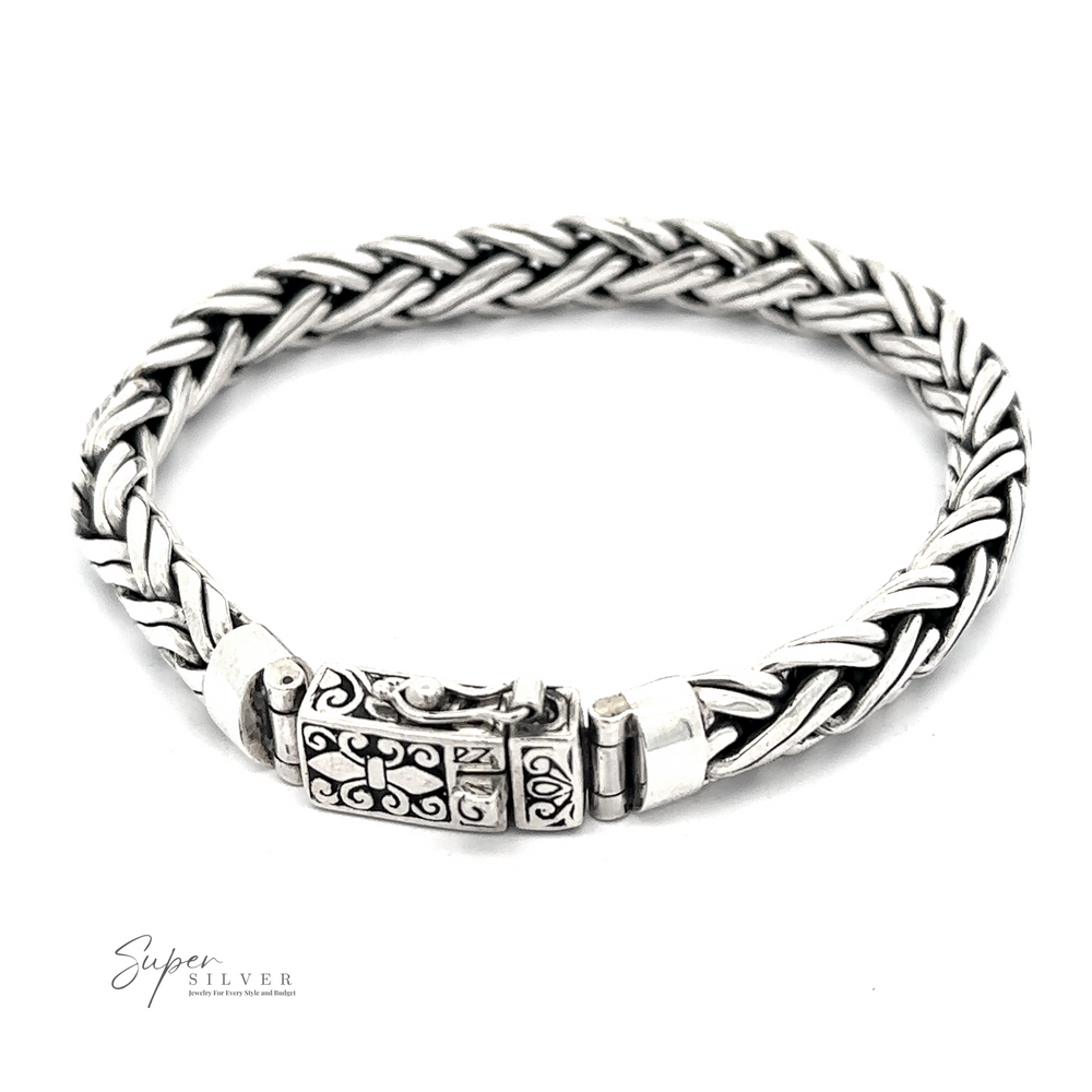 A Heavy Double Strand Braided Bracelet in .925 Sterling Silver, featuring an intricate clasp and the branding "Super SILVER" written in the corner, presents a stunning statement piece with its detailed pattern.