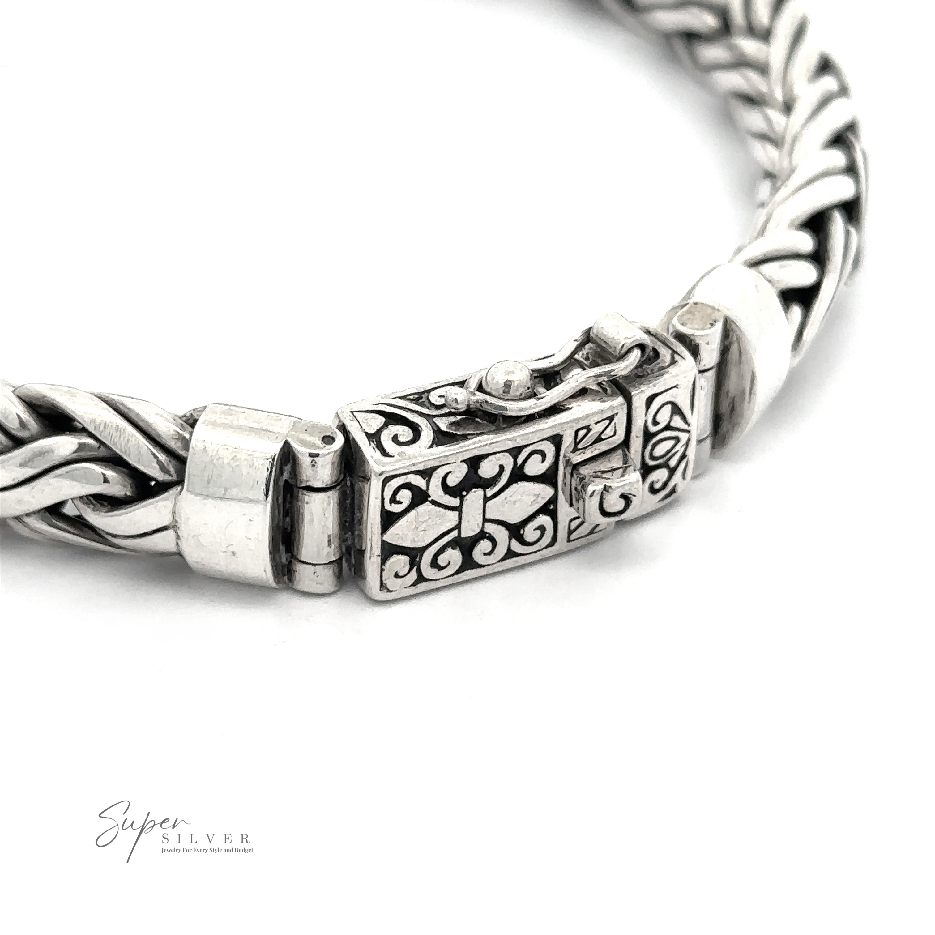 Close-up of a Heavy Double Strand Braided Bracelet with an intricate woven design and an ornamental clasp, crafted from .925 Sterling Silver, featuring the logo “Super Silver” in the bottom left corner.