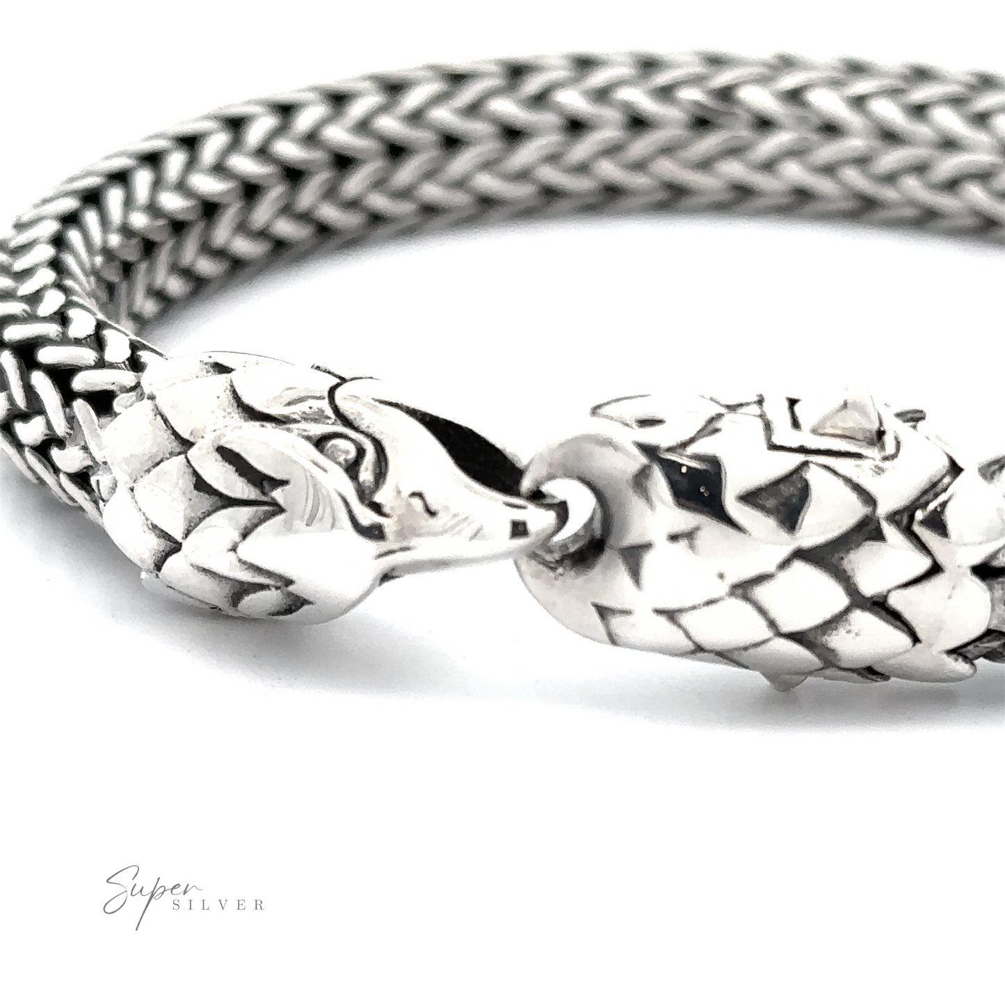 Close-up of a Heavy Braided Bracelet with Eagle Clasp, crafted from .925 Sterling Silver, with intricately detailed eagle head clasps on both ends, connected by a woven chain. The brand name "Super Silver" is visible in small font on the bottom left.