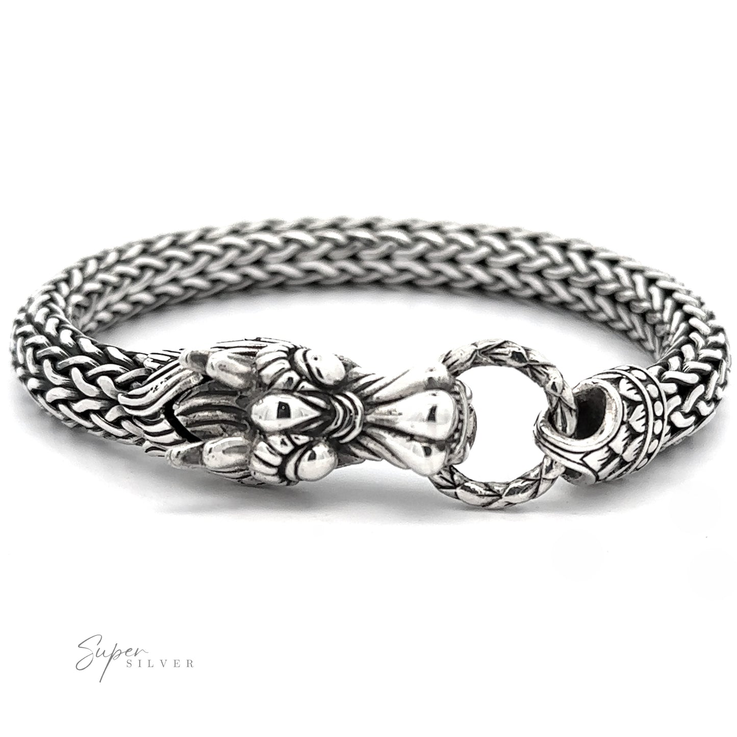 
                  
                    Sterling Silver Braided Rope Bracelet with Dragon Head with an intricate woven chain design and ornate clasp featuring bold dragon-like details. The sterling silver clasp ring connects to a decorative end piece, making a bold statement. Branding at bottom left corner.
                  
                