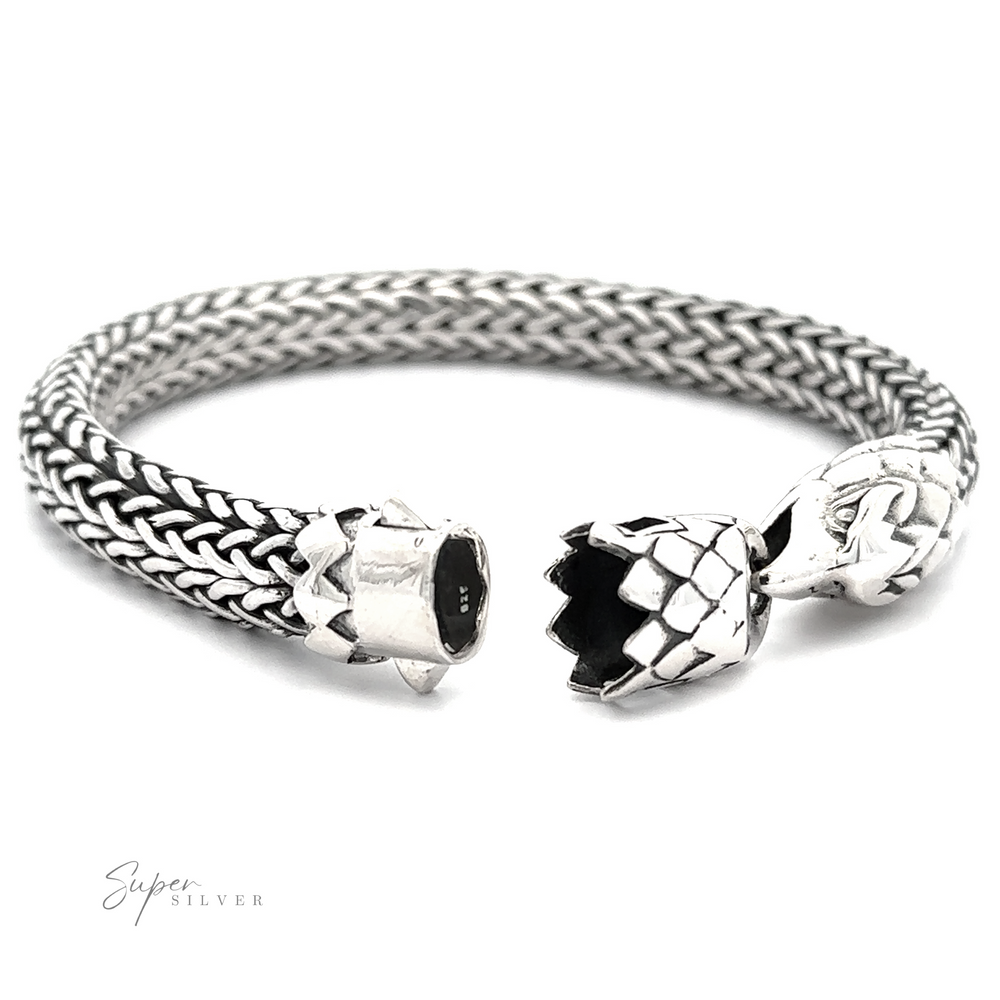 
                  
                    A Heavy Braided Bracelet with Eagle Clasp, featuring dragon head-shaped ends. Crafted from .925 Sterling Silver, the bracelet is open at one end, displaying intricate detailing. The words "Super Silver" are inscribed at the bottom left.
                  
                