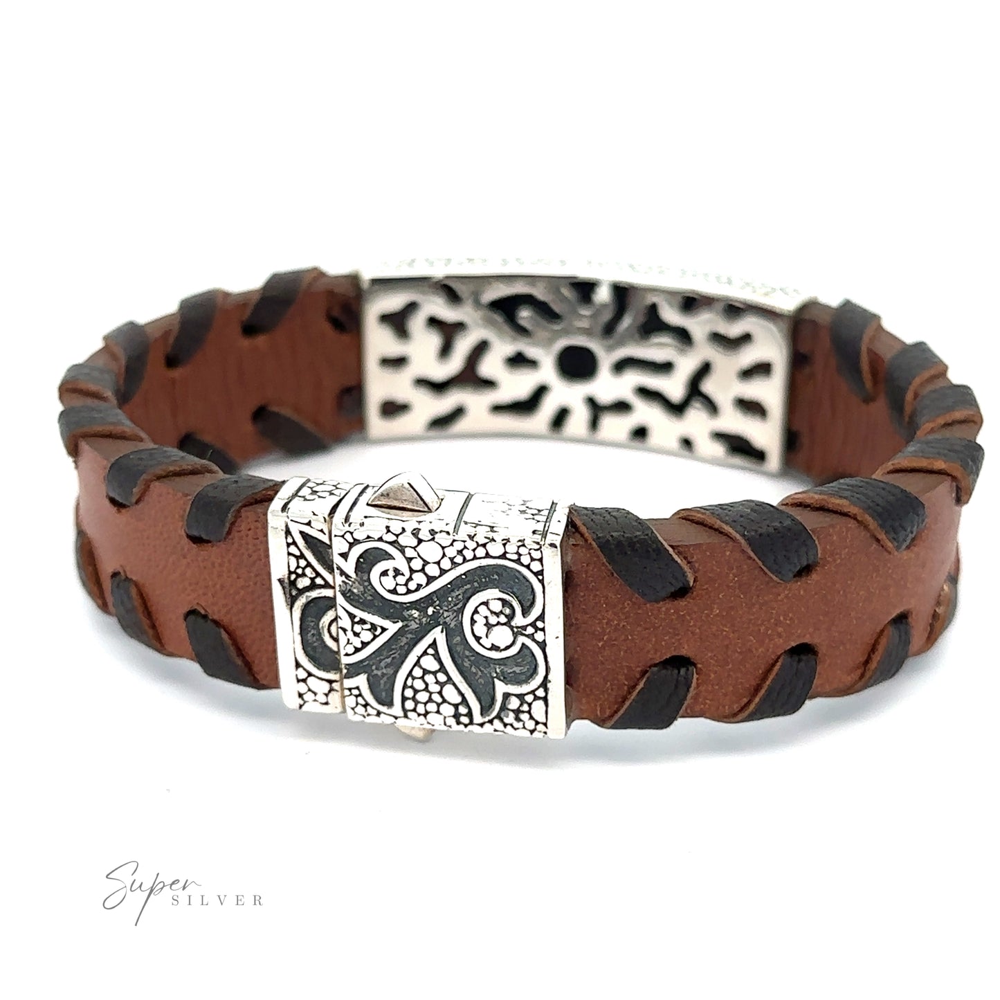 
                  
                    A Tribal Leather Bracelet with black threading and silver decorative clasps featuring intricate designs. The bracelet showcases a tribal silver center and has an embossed logo, "Super Silver," in the bottom left corner.
                  
                