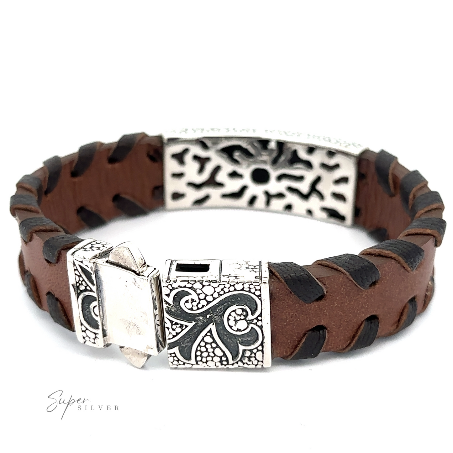 
                  
                    A Tribal Leather Bracelet with a brown leather strap, featuring a tribal silver center and decorative clasp with intricate designs. The brand name "Super Silver" is visible on the clasp.
                  
                