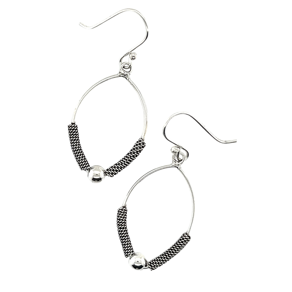 
                  
                    Handmade Super Silver Bali Rope Texture earrings with black beads.
                  
                