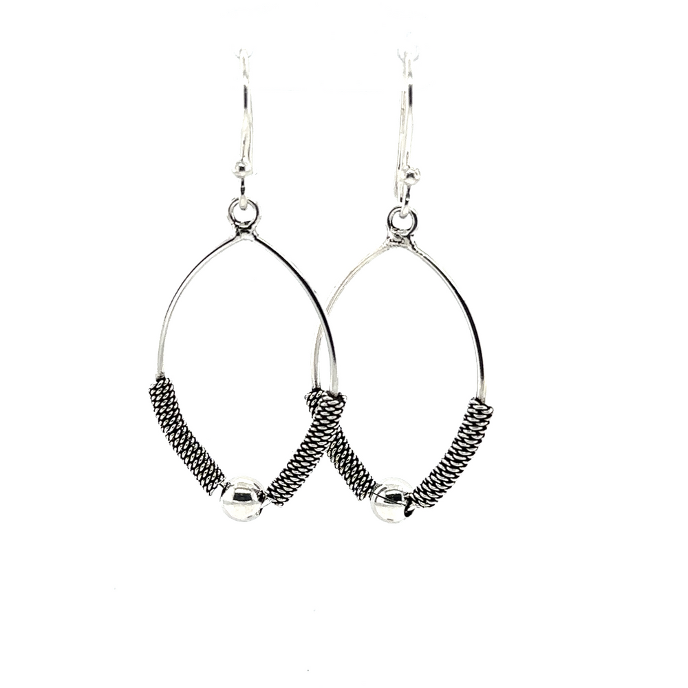 A pair of Super Silver Bali Rope Texture earrings with beads featuring delicate silver work.