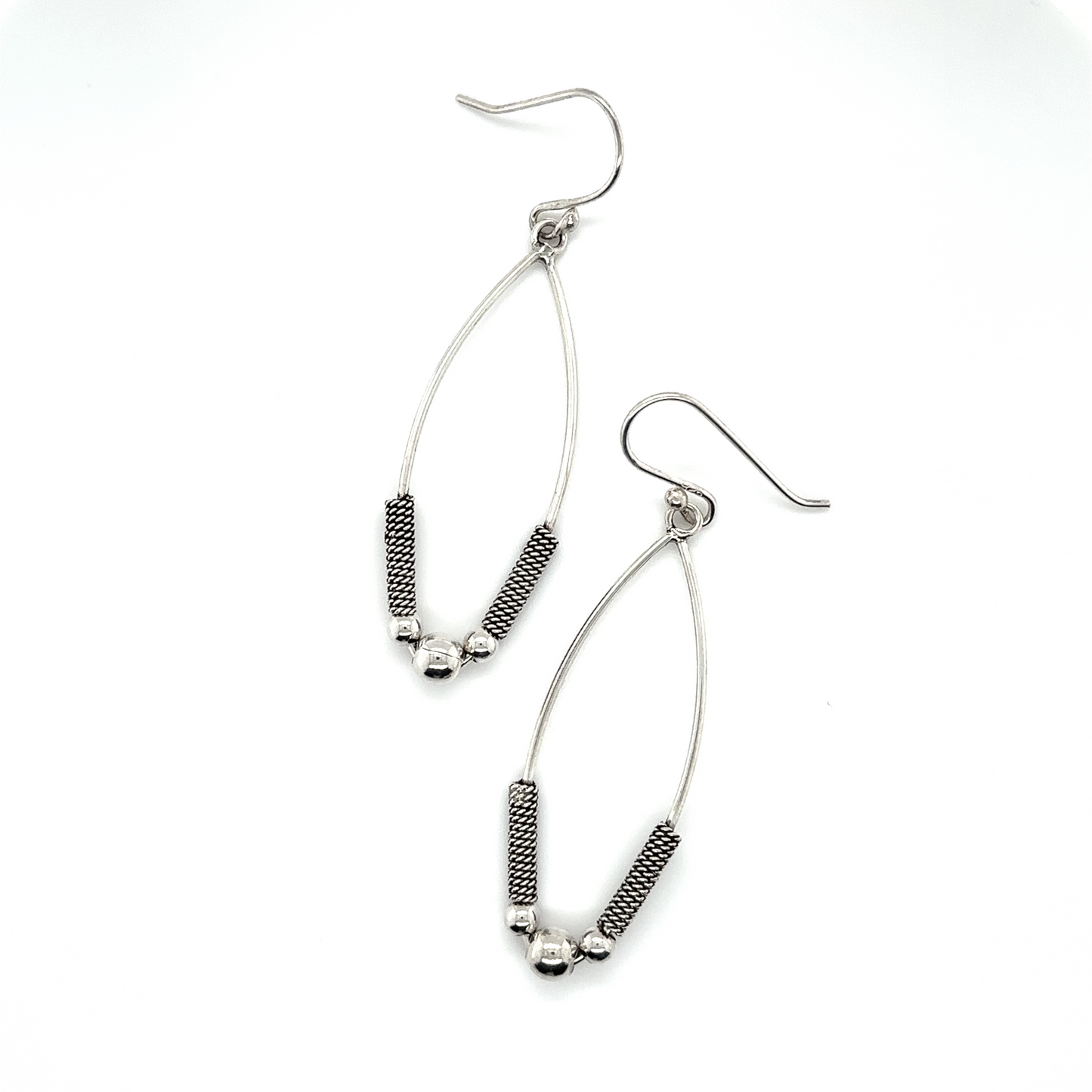 
                  
                    A pair of Super Silver Bali Style Marquise Drop Earrings with black beads.
                  
                