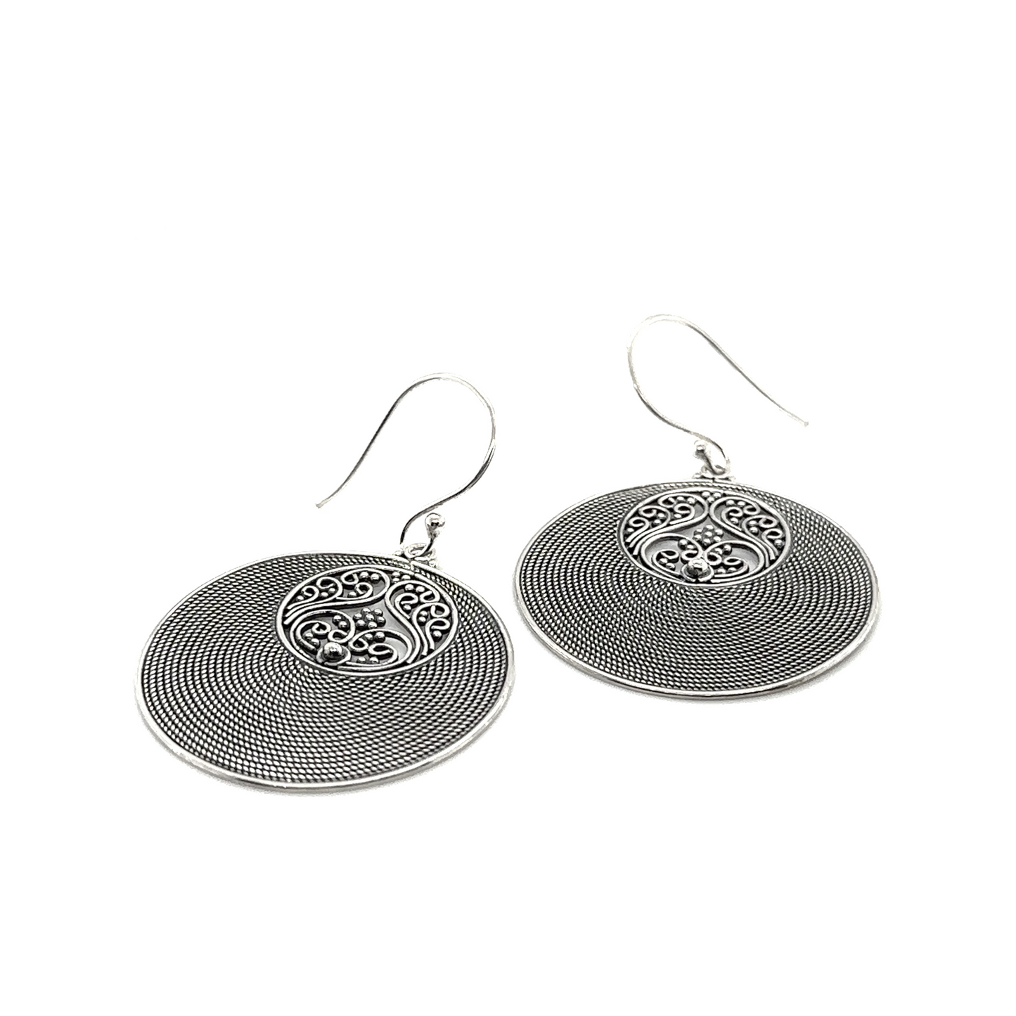 
                  
                    A pair of Super Silver Statement Intricate Round Bali Earrings with a circular design.
                  
                