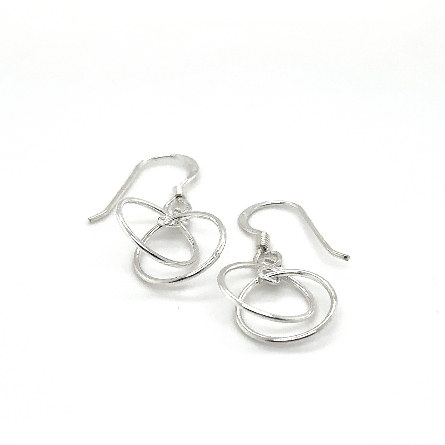 
                  
                    Super Silver's Interlinked Circle Earrings, crafted from .925 Sterling Silver, with a swirl design.
                  
                