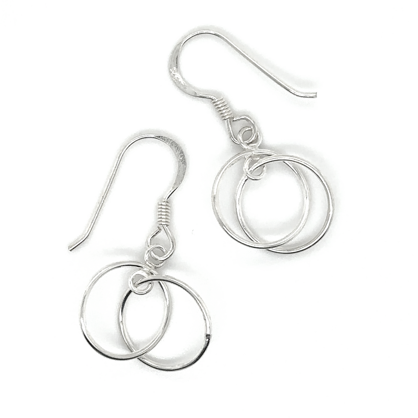 
                  
                    A pair of Super Silver Interlinked Circle Earrings made of .925 Sterling Silver, showcased on a white background.
                  
                