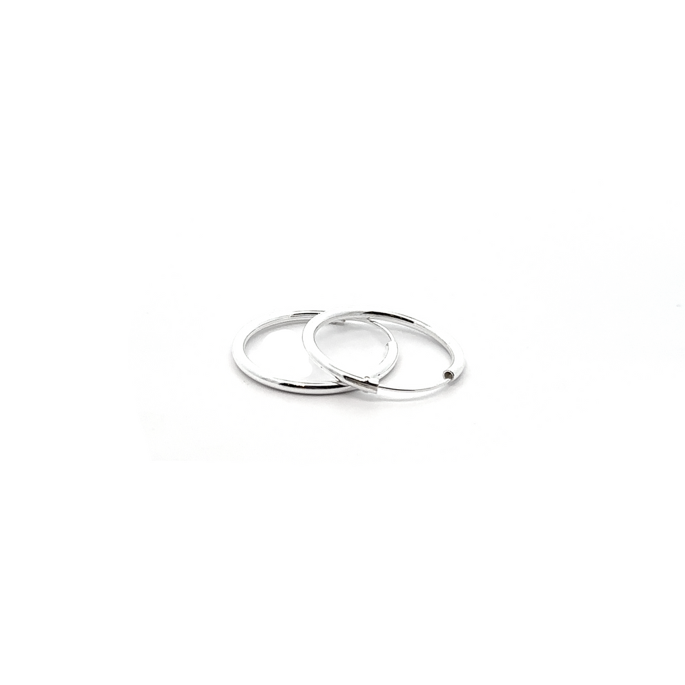 
                  
                    A pair of 2mm Infinity Hoops on a white background.
                  
                