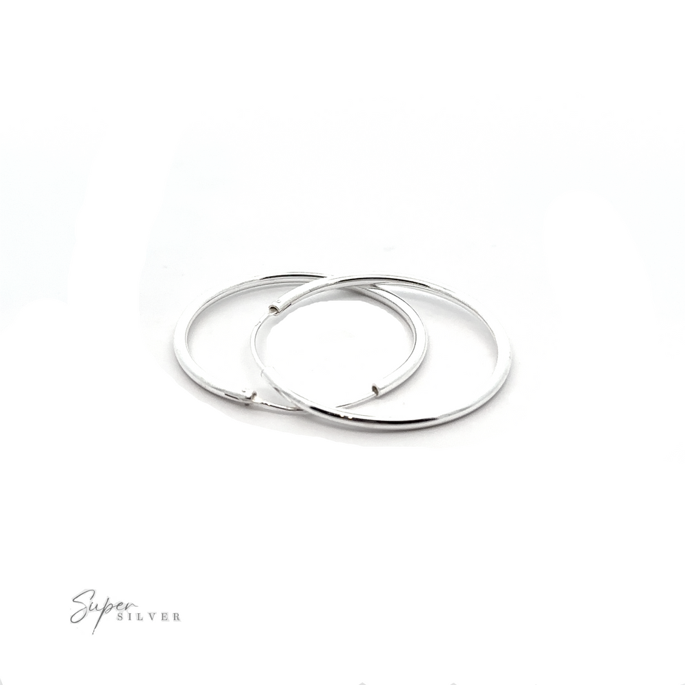 
                  
                    Versatile 2mm Infinity Hoops with minimalist flair on a white background.
                  
                