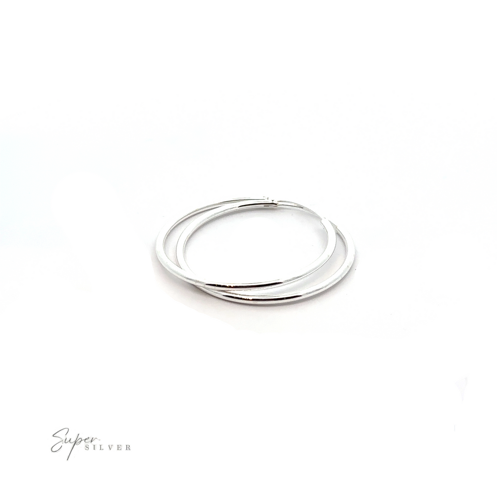 
                  
                    A pair of 2mm Infinity Hoops that add a touch of minimalist flair on a white background.
                  
                