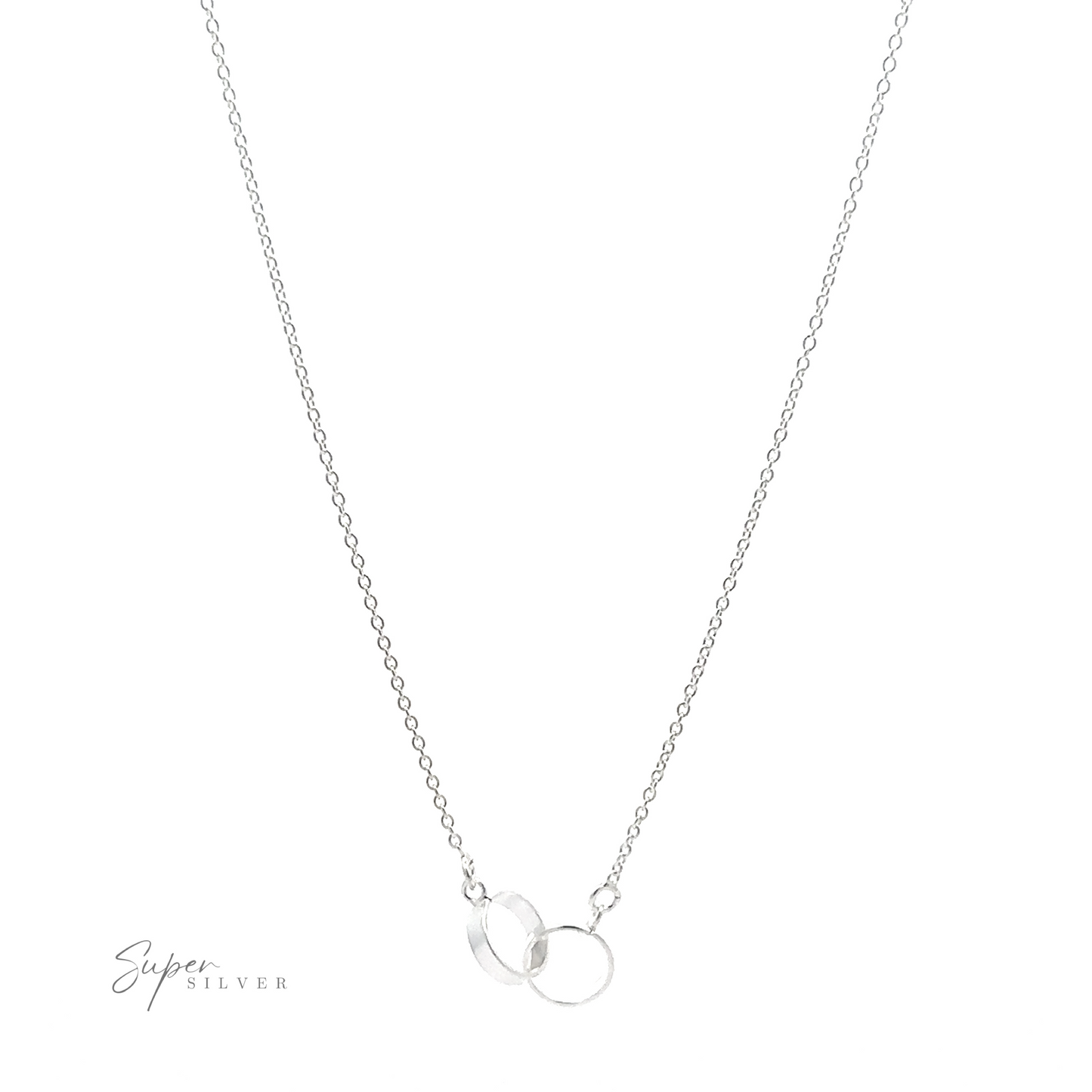 A Double Circle Necklace with a delicate chain features two interlocking rings as a pendant, symbolizing an eternal bond. The double-circle necklace is thin and minimalistic, perfect for everyday wear. The logo "Super Silver" appears in the bottom left corner.